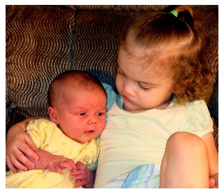 Ella holds baby Kate.